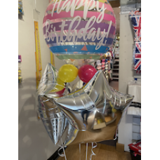 Cluster of star shaped foil balloons with a bubble balloon on top. (Collection only - select click and collect on checkout page)